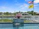 This inviting backyard pool with waterfall is the perfect spot to unwind and offers views of the canal at 574 Bimini Bay Blvd, Apollo Beach, FL 33572