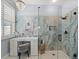 Modern shower with glass, marble tiles, and vanity at 574 Bimini Bay Blvd, Apollo Beach, FL 33572