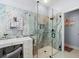 Stylish shower featuring glass and marble tile at 574 Bimini Bay Blvd, Apollo Beach, FL 33572