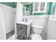 Well-lit bathroom with grey vanity, white tile, updated lighting, and modern shower at 5947 46Th N Ave, Kenneth City, FL 33709