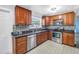 Updated kitchen has stainless steel appliances, granite counters, tile backsplash and decorative tile floor at 5947 46Th N Ave, Kenneth City, FL 33709