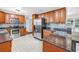 Beautifully updated kitchen features stainless steel appliances, granite countertops, and custom wood cabinets at 5947 46Th N Ave, Kenneth City, FL 33709