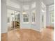 A breakfast nook with bright, natural light and sliding glass door to lanai at 6127 Cezanne Ave, Lutz, FL 33558