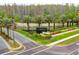 Beautiful entrance with lush landscaping, palm trees, and clear Cheval signage at 6127 Cezanne Ave, Lutz, FL 33558