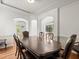 Formal dining room with hardwood floors and decorative molding, perfect for gatherings at 6127 Cezanne Ave, Lutz, FL 33558