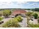 Attractive community clubhouse with porte cochere, red tile roof, and convenient parking at 6127 Cezanne Ave, Lutz, FL 33558