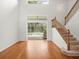 Open-concept living area with a staircase and access to the outdoor pool and patio at 6127 Cezanne Ave, Lutz, FL 33558
