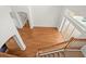 High-ceiling Living room with hardwood floors, stairs, and lots of light at 6127 Cezanne Ave, Lutz, FL 33558