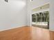 Spacious living room featuring sliding glass doors leading to the outdoor pool area at 6127 Cezanne Ave, Lutz, FL 33558