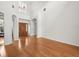 Bright living room with hardwood floors, high ceilings, and a stylish entryway at 6127 Cezanne Ave, Lutz, FL 33558