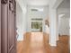 Bright living room with hardwood floors, tall ceilings, and pool view at 6127 Cezanne Ave, Lutz, FL 33558