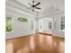 A bright living room with trey ceilings, columns, and large windows at 6127 Cezanne Ave, Lutz, FL 33558