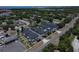Aerial view of townhouses with parking, landscaping, and nearby amenities in a residential area at 6619 S Manhattan Ave # 1, Tampa, FL 33616