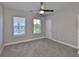 Large bedroom with ceiling fan, ample natural light, and windows overlooking the neighborhood at 6619 S Manhattan Ave # 1, Tampa, FL 33616