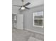 Bedroom featuring a ceiling fan, window with blinds, and attached bath with decorative tile at 6619 S Manhattan Ave # 1, Tampa, FL 33616