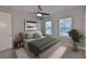 Staged bedroom with modern décor, a comfy bed, bedside tables, windows, and stylish rug at 6619 S Manhattan Ave # 1, Tampa, FL 33616
