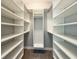 Organized walk-in closet with ample shelving and storage space for clothes and accessories at 6619 S Manhattan Ave # 1, Tampa, FL 33616