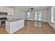 Open floorplan showcasing the kitchen with a granite island and modern stainless steel appliances at 6619 S Manhattan Ave # 1, Tampa, FL 33616
