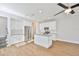 Well-lit kitchen with white cabinetry, granite countertops, and stainless steel appliances at 6619 S Manhattan Ave # 1, Tampa, FL 33616