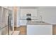Modern kitchen featuring stainless steel appliances, granite countertops, and white cabinets at 6619 S Manhattan Ave # 1, Tampa, FL 33616