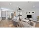 Stylish living area with a contemporary gray sofa, modern decor, and seamless flow into the open kitchen and dining space at 6619 S Manhattan Ave # 1, Tampa, FL 33616
