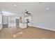 Bright, open-concept living space features hardwood floors, modern furnishings, and easy access to the kitchen and dining areas at 6619 S Manhattan Ave # 1, Tampa, FL 33616