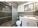 Modern bathroom with tiled walk-in shower, updated vanity, and sleek fixtures at 6960 20Th N Ave # 203B, St Petersburg, FL 33710