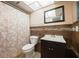 Bathroom featuring a tiled shower/tub, dark wood vanity, and stylish neutral design elements at 6960 20Th N Ave # 203B, St Petersburg, FL 33710
