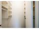 Walk-in closet with built-in shelving and closet rods for organized storage at 6960 20Th N Ave # 203B, St Petersburg, FL 33710