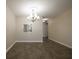 Dining room with modern flooring, chandelier and neutral paint palette at 6960 20Th N Ave # 203B, St Petersburg, FL 33710