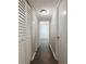 Hallway with tile flooring, linen closet and views into rooms at 6960 20Th N Ave # 203B, St Petersburg, FL 33710