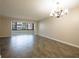 Large living room features tiled flooring and a view of the outside at 6960 20Th N Ave # 203B, St Petersburg, FL 33710