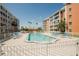 Community swimming pool surrounded by lounge chairs and well maintained landscaping at 6960 20Th N Ave # 203B, St Petersburg, FL 33710