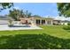 Backyard view highlighting the pool, patio, roof, lawn, seating and fenced in space at 708 Westwood Cir, Brandon, FL 33511