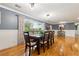 Spacious dining room showcasing hardwood floors, a large window, and tasteful decor, ideal for gatherings at 708 Westwood Cir, Brandon, FL 33511