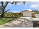 Inviting single-story home with a well-manicured lawn, beautiful landscaping, and an attached two-car garage at 708 Westwood Cir, Brandon, FL 33511