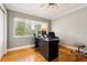Bright office with hardwood floors, a large window, and a ceiling fan at 708 Westwood Cir, Brandon, FL 33511