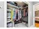 Spacious walk-in closet with custom shelving, ample storage, and a marble tile floor at 708 Westwood Cir, Brandon, FL 33511