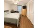 Bright bedroom with hardwood floors, ceiling fan, desk, and closet at 7312 Nova Cir, Tampa, FL 33634