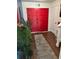 Bright entryway with hardwood floors, double doors, and a neutral-colored area rug at 7312 Nova Cir, Tampa, FL 33634