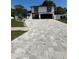 Two-story home with a large driveway and well-maintained lawn in a quiet neighborhood at 7312 Nova Cir, Tampa, FL 33634