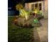 Landscaped front yard with dark mulch, rock bed, colorful flowers and grass at 7312 Nova Cir, Tampa, FL 33634