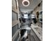 Contemporary bathroom showcasing stylish black and white marble walls and floors, along with a modern glass shower at 7834 Treasure Pointe Dr, Port Richey, FL 34668