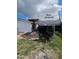 Backyard featuring RV trailer and quaint home at 7834 Treasure Pointe Dr, Port Richey, FL 34668