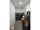 Modern laundry room featuring a washer and dryer at 7834 Treasure Pointe Dr, Port Richey, FL 34668