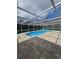 Spacious screened-in pool and cool deck for outdoor relaxation and enjoyment at 7834 Treasure Pointe Dr, Port Richey, FL 34668