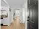 Inviting entryway featuring wood-look floors, leading to rooms, with a glimpse of the kitchen to the left at 800 S Dakota Ave # 337, Tampa, FL 33606
