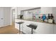 Kitchen bar with granite countertops and seating for two, perfect for casual dining at 800 S Dakota Ave # 337, Tampa, FL 33606