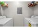 Laundry room with new white washer and dryer units at 800 S Dakota Ave # 337, Tampa, FL 33606