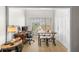 Bright, functional home office space with a large window, a wooden desk, and comfortable seating at 800 S Dakota Ave # 337, Tampa, FL 33606
